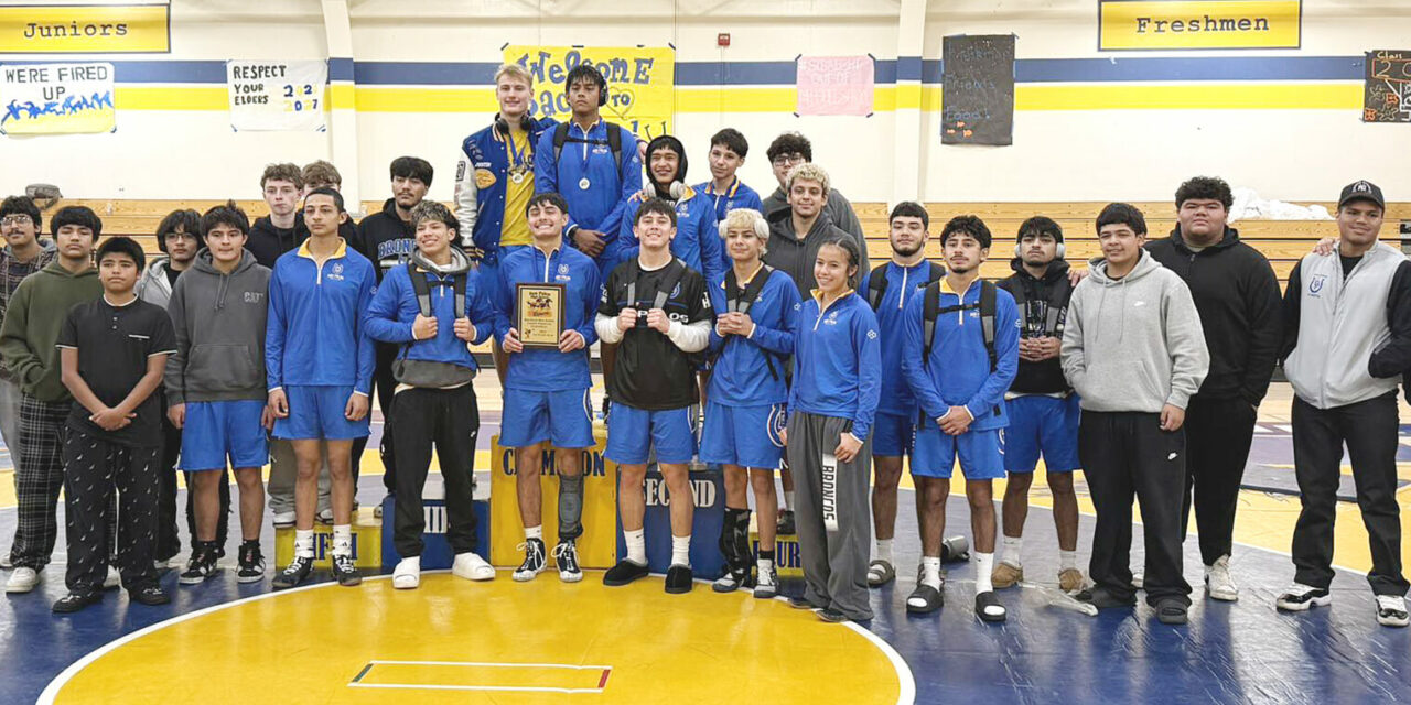 High school wrestlers dive into tournament action